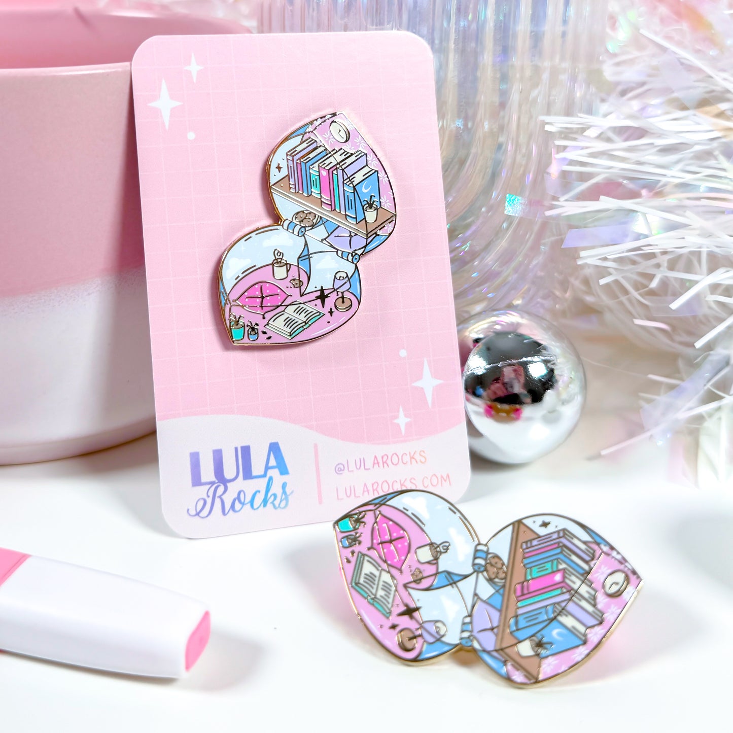 Pin and card styled with reflective background and books