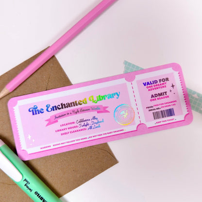 Pink ticket-style library card with 'The Enchanted Library' branding on a white background.