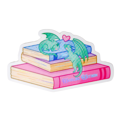 Sticker with two dragons on books, one pink and one blue, on a white background