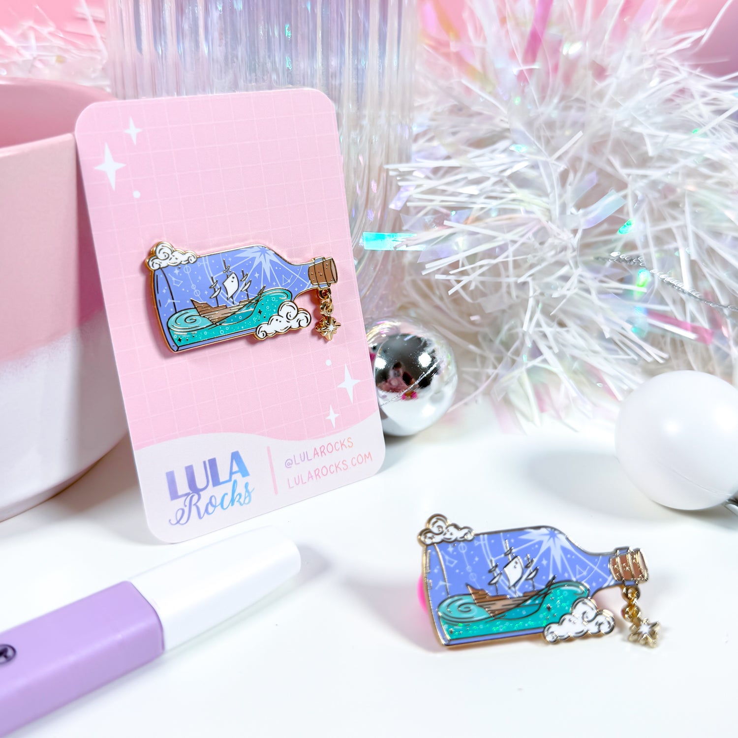 Ocean-inspired Ship in a Bottle enamel pin, perfect for navigating life's challenges