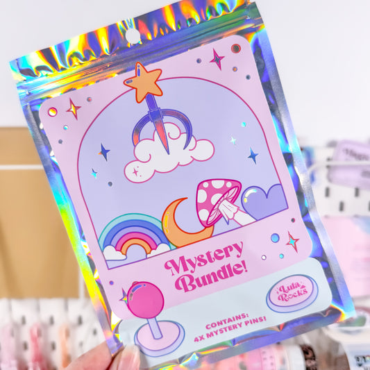 Holographic packaging of a 'Mystery Bundle' with colorful designs on a blurred background.