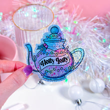 Load image into Gallery viewer, Close-up of Holly Jolly Brew Potion glitter sticker with pixie dust and glossy finish