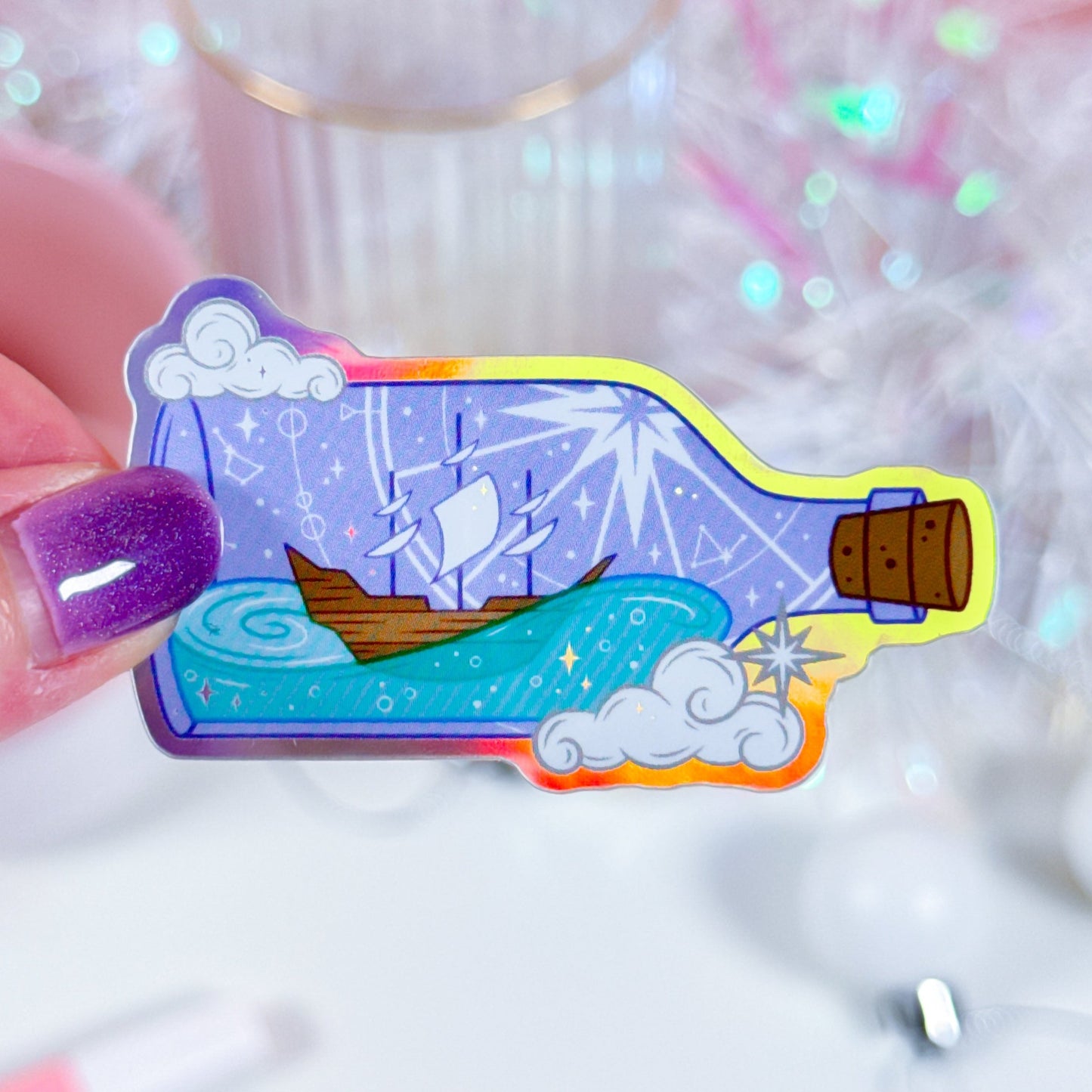 Ship in a Bottle holographic vinyl sticker, featuring a sailing ship and ocean waves