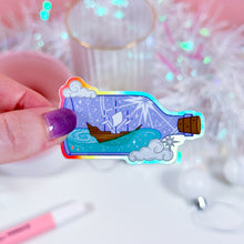 Load image into Gallery viewer, Close-up of holographic Ship in a Bottle sticker, perfect for stationery lovers and sticker collectors